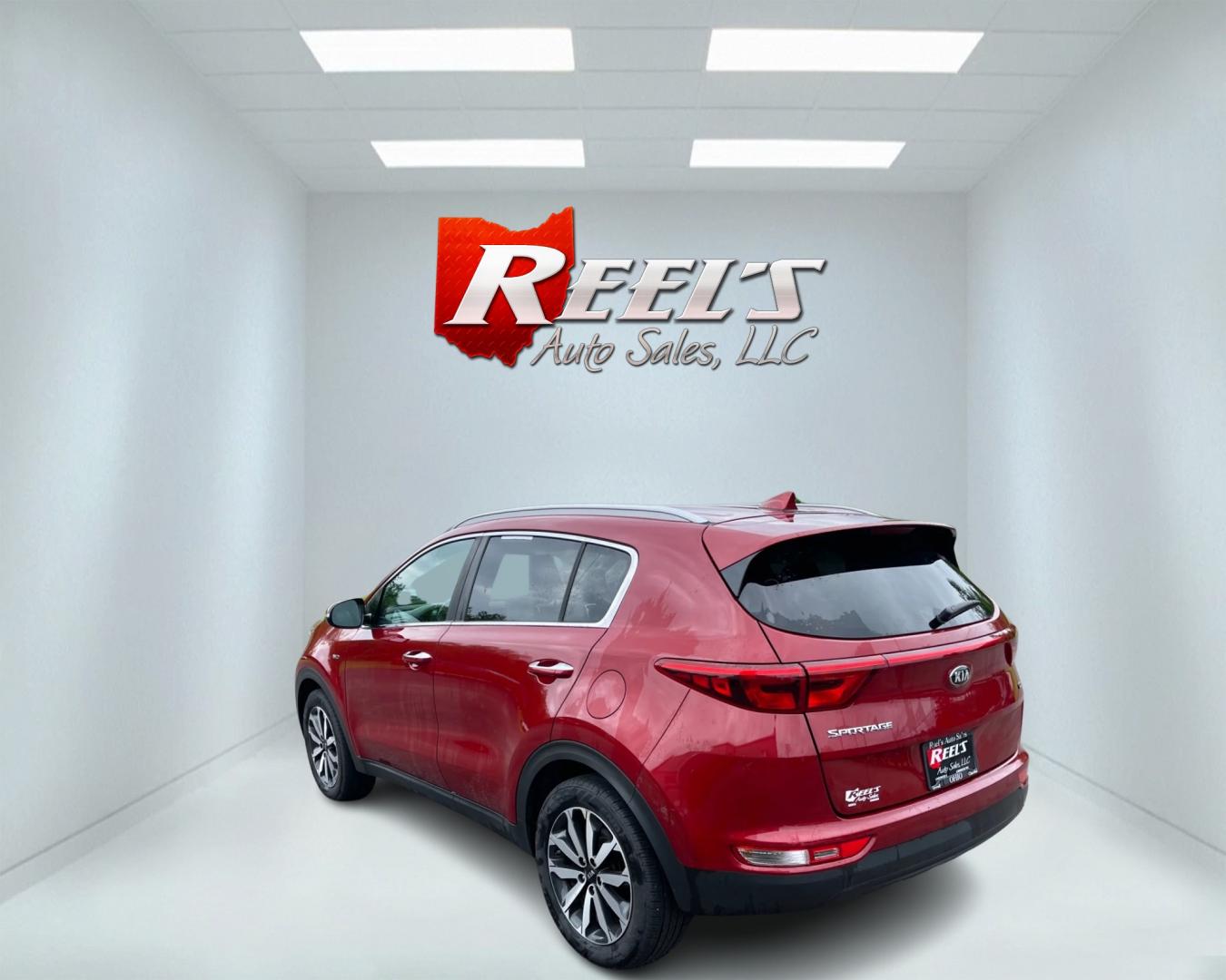 2018 Red /Gray Kia Sportage EX AWD (KNDPNCAC3J7) with an 2.4L I4 DOHC 24V engine, 6A transmission, located at 547 E. Main St., Orwell, OH, 44076, (440) 437-5893, 41.535435, -80.847855 - This 2018 Kia Sportage EX AWD is a well-rounded compact SUV that offers a good blend of capability and features. It comes equipped with a 2.4L I4 GDI engine paired with a 6-speed automatic transmission and AWD system with locking center differential. The driving experience is enhanced by features li - Photo#7